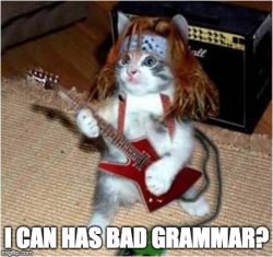 Cat playing guitar saying, "I can has bad grammar?"